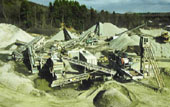 Producing concrete aggregate. The finished stone products are washed while the dust and screenings remain dry